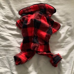 XS dog pajamas.  Red and black check.